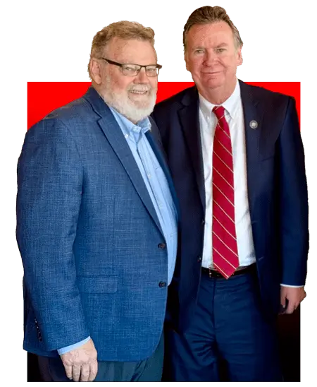 Les Heidelberg and St. Tammany Parish President Mike Cooper posing for a photo